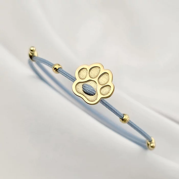 Brățara Paw – pandantiv lăbuță si 2 biluțe 3 mm pe Snur albastru Gros, din Argint 925 placat cu Aur Galben 18K